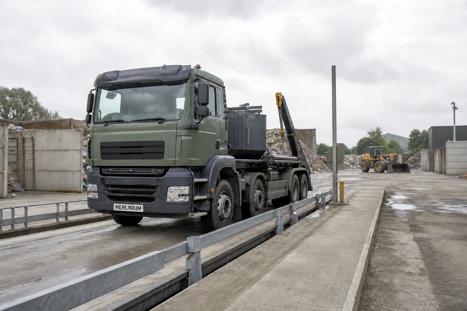 Merlinium-branded waste vehicle on an industrial weighbridge